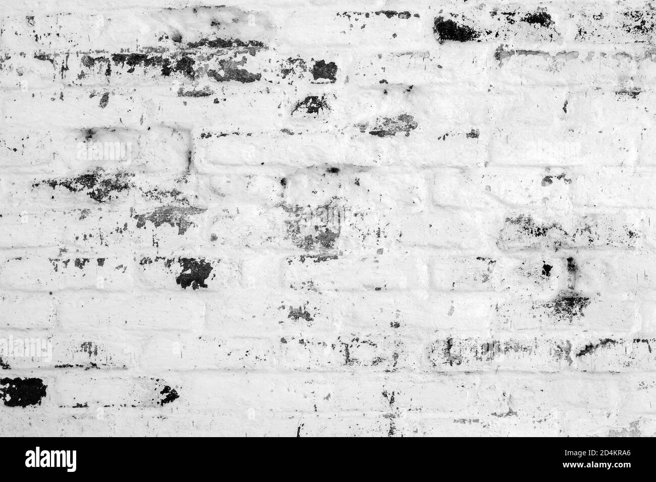 Vecchia vintage retro danneggiato muratura in mattoni bianchi e neri. Texture mattone con graffi. Foto Stock