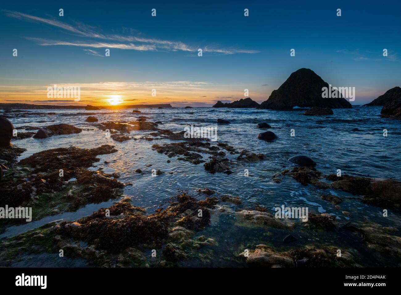 Tramonto a Ballintoy, White Park Bay, County Antrim, Irlanda del Nord Foto Stock