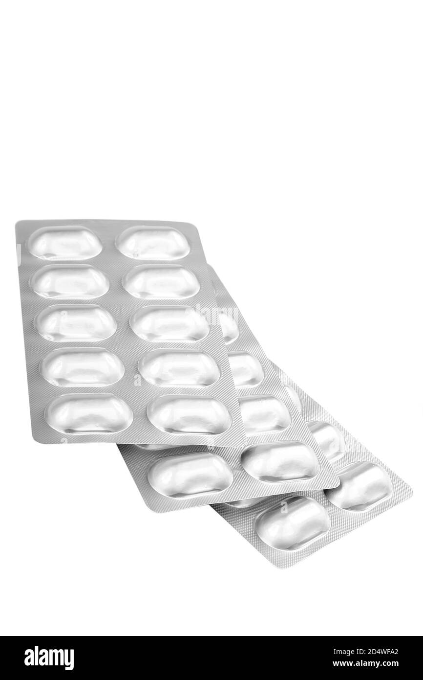 Pillole in blister isolati su sfondo bianco. Foto Stock