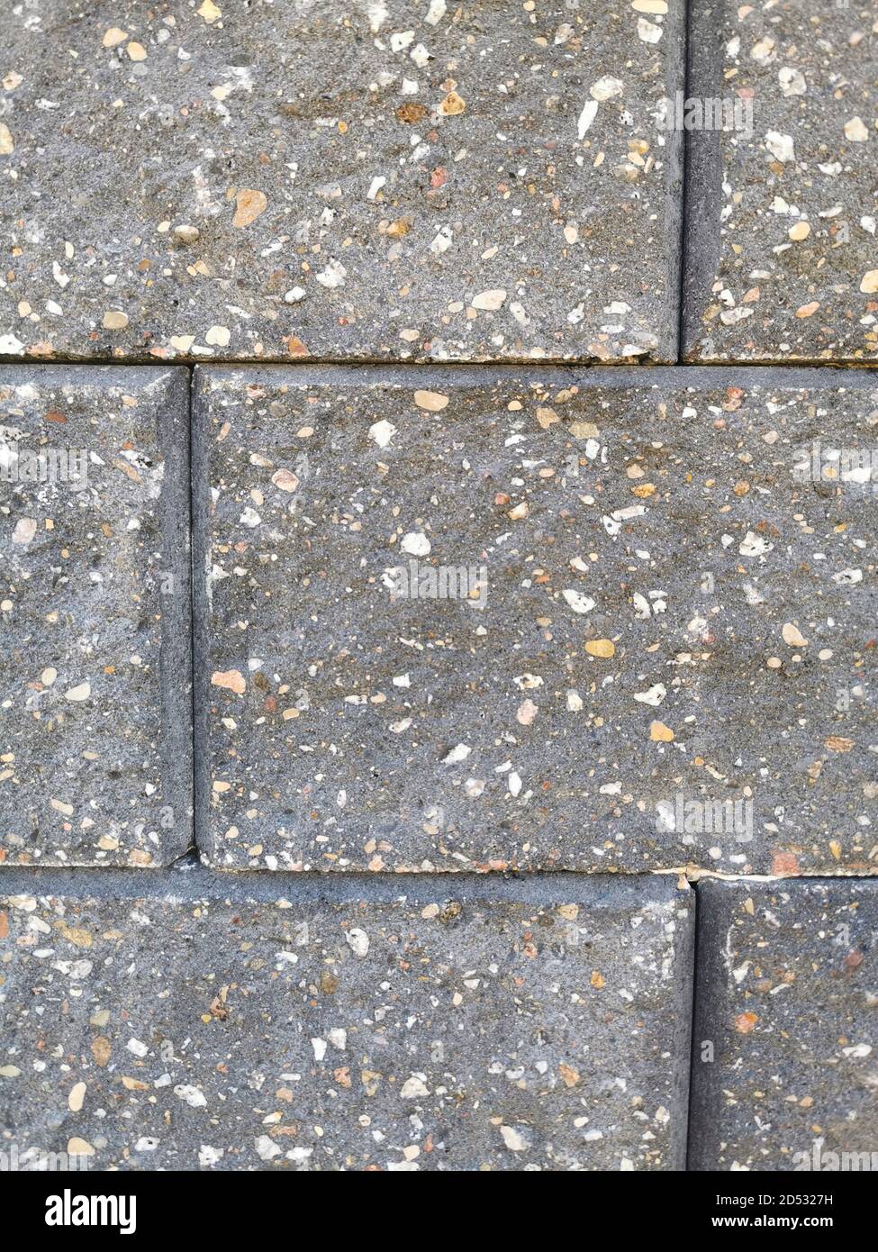 Muro grigio in pietra di mattoni da vicino Foto Stock