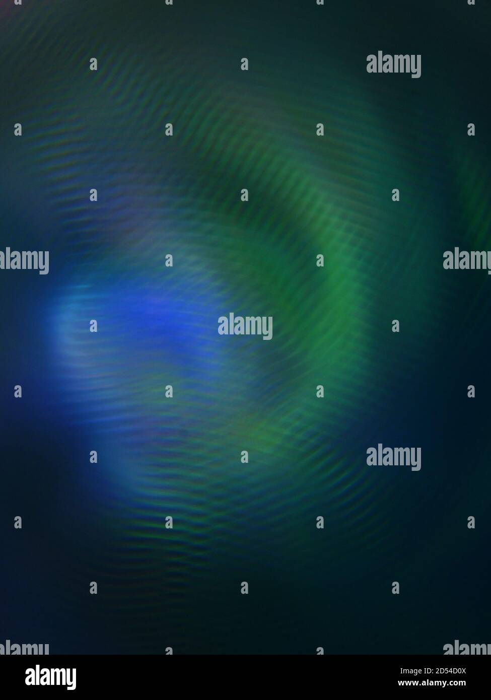 Immagine verticale di luci colorate astratte su uno sfondo scuro Foto Stock