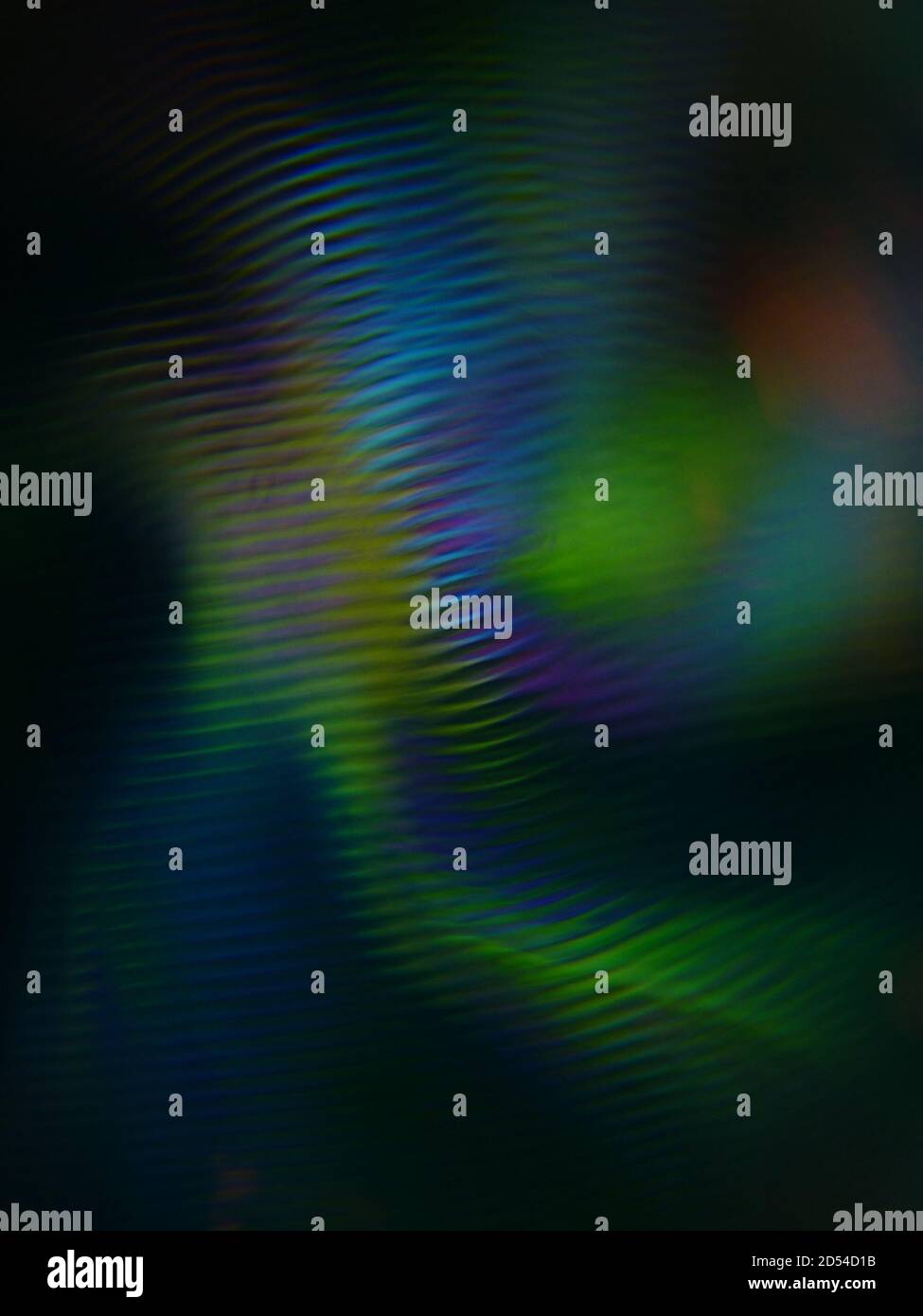 Immagine verticale di luci colorate astratte su uno sfondo scuro Foto Stock