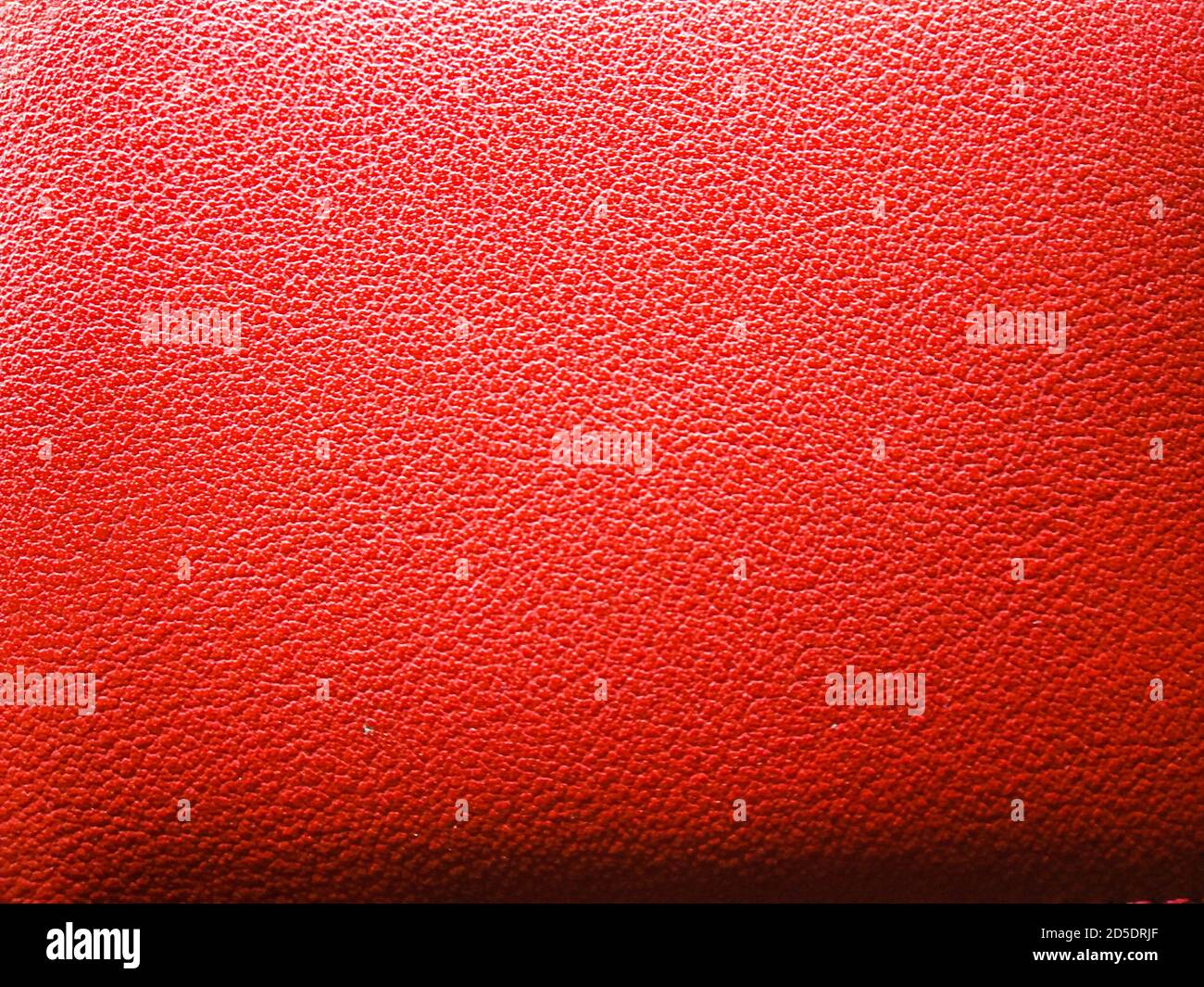 Texture in pelle rossa Elegance per sfondo con dettagli visibili.tessuto in pelle rosa background.grunge sfondo in pelle, vera pelle di cammello. Foto Stock