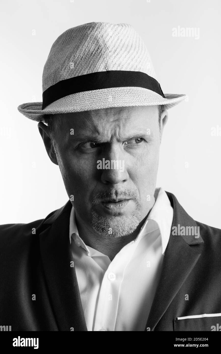 Faccia di grave imprenditore maturo guardando a lato Foto Stock