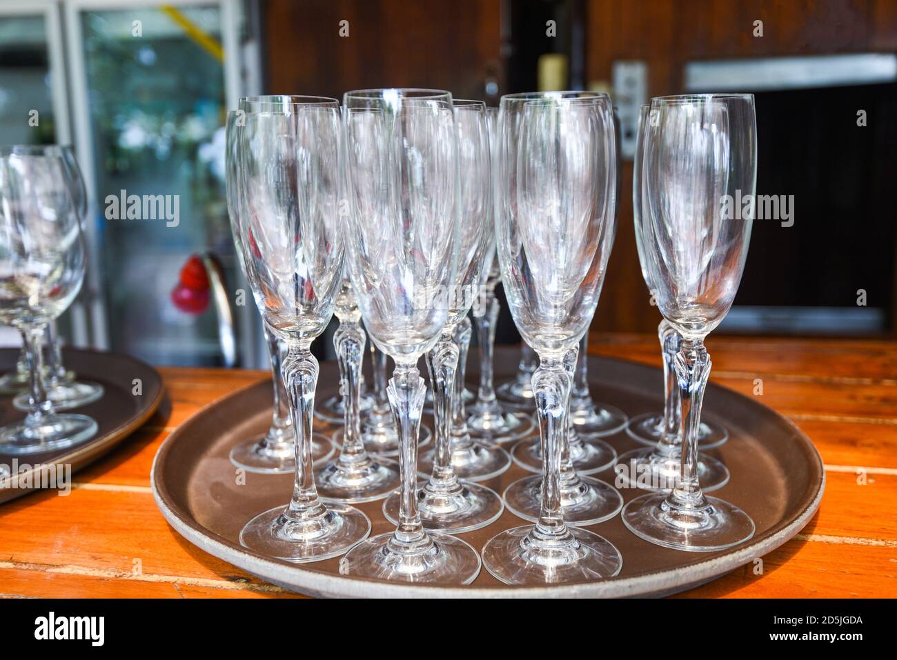 Champagne glass stand on the table / Empty glass of champagne or Wine glass Foto Stock