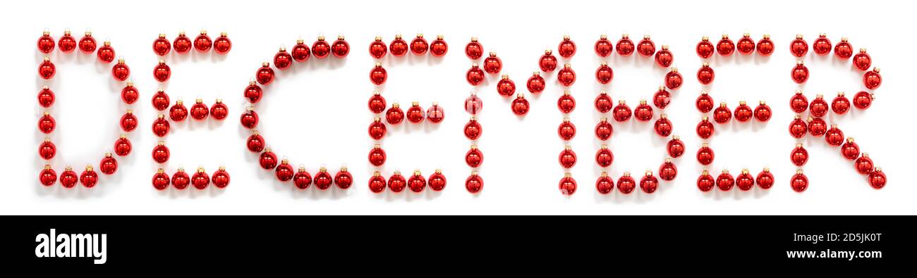 Red Christmas Ball Ornament Building Word dicembre Foto Stock