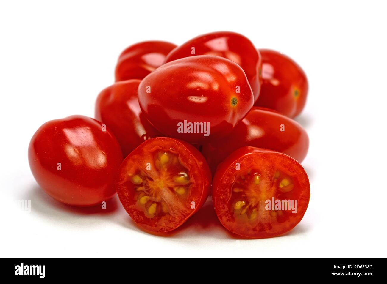 Mini pomodori roma su sfondo bianco Foto Stock