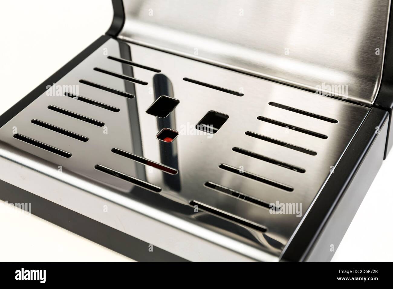 Vassoio antigoccia in plastica nera e metallo lucido Foto Stock