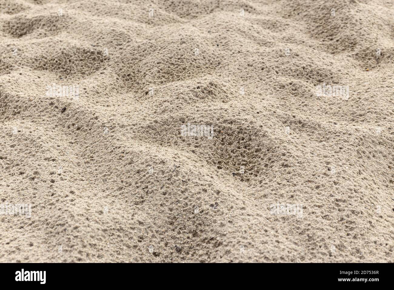 Sabbia sfondo texture dopo la pioggia. Spiaggia di sabbia bagnata Foto Stock