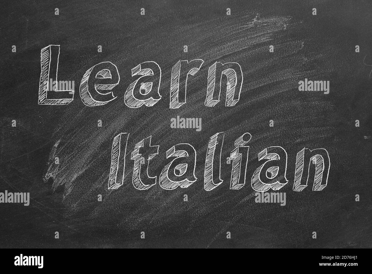 Disegno a mano 'Impara l'italiano' sulla lavagna Foto Stock