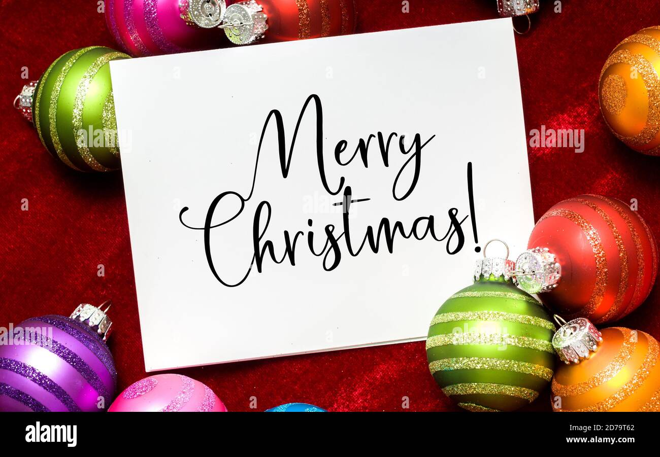 Baubles di Natale, palla con nota augurando buon Natale Foto Stock