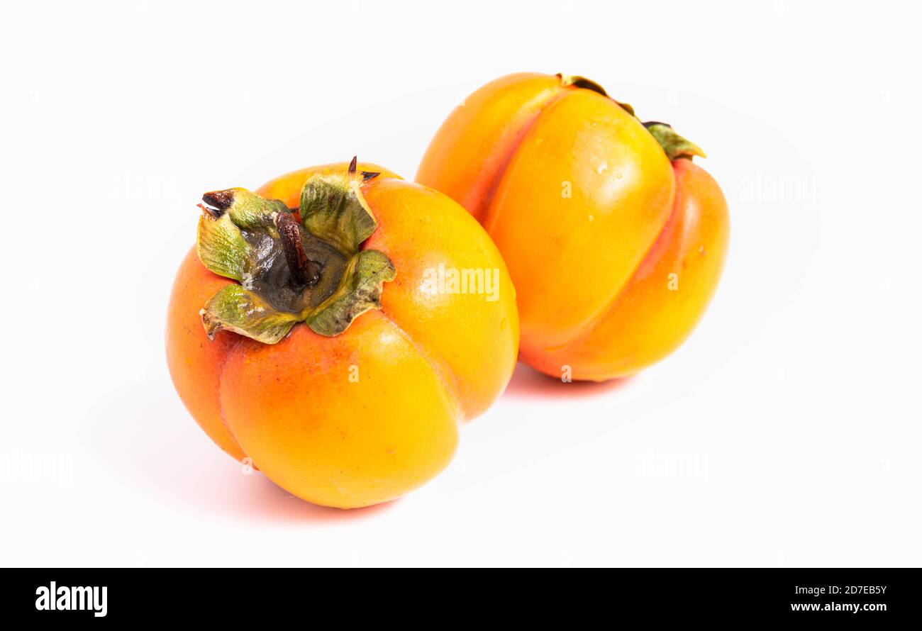 isolare, frutto persimmon su sfondo bianco, primo piano Foto Stock