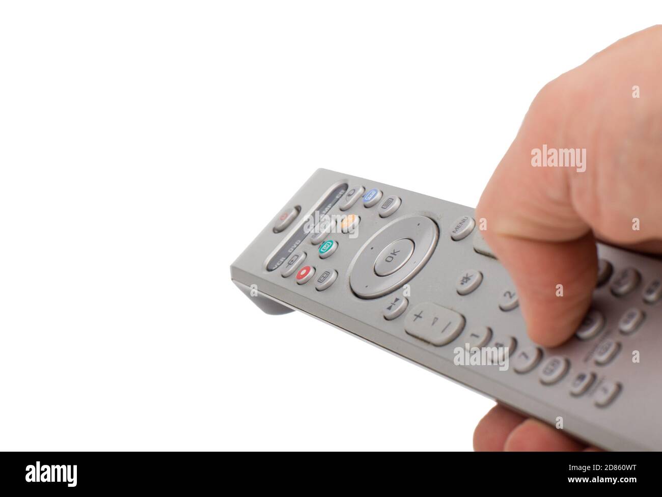 Telecomando in argento con pressione manuale isolato su sfondo bianco. Telecomando in argento per TV in un'altra postazione isolata a mano. Foto Stock