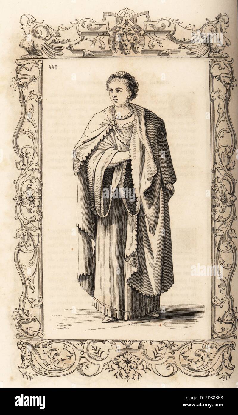 Costume di una donna africana o berbera del regno di Tlemcen, Impero Ottomano (Algeria), 16 ° secolo. Capo su un accappatoio con maniche grandi, attaccate con una fibbia di oro o argento, orecchini in oro. All'interno di una cornice decorativa incisa da H. Catenacci e Fellmann. Incisione di blocchi di legno di Gerard Seguin e E.F. Huyot dopo un taglio di legno di Christoph Krieger dai costumi di Cesare Vecellio del XVI secolo anciens et modernes, Habiti antichi et moderni di tutto il mondo, Firman Didot Ferris Fils, Parigi, 1859-1860. Foto Stock