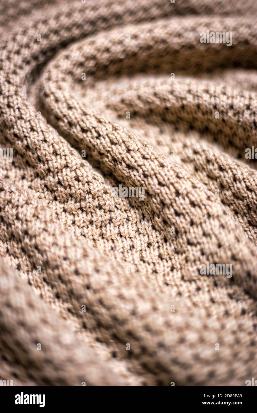 Sfondo beige a maglia, coperta calda. Buon modello per il design. Foto Stock