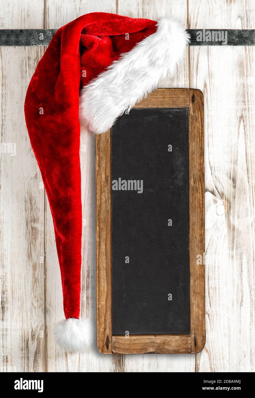 Natale decorazione cappello di Santa e vintage cartello lavagna Foto Stock
