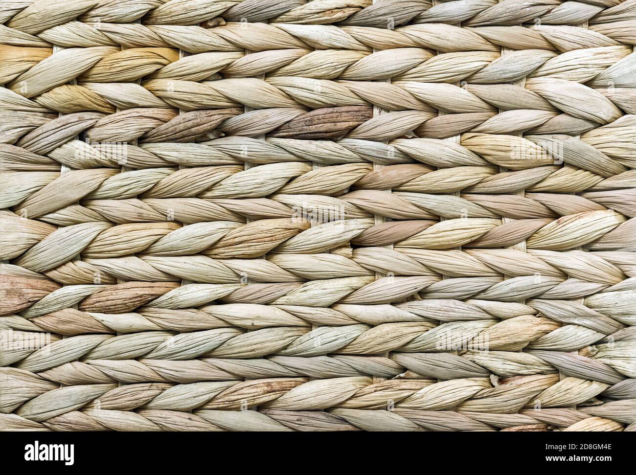 Tessuto vimini. Sfondo di tessitura di canna. Tessitura ruvida dalla paglia. Foto Stock