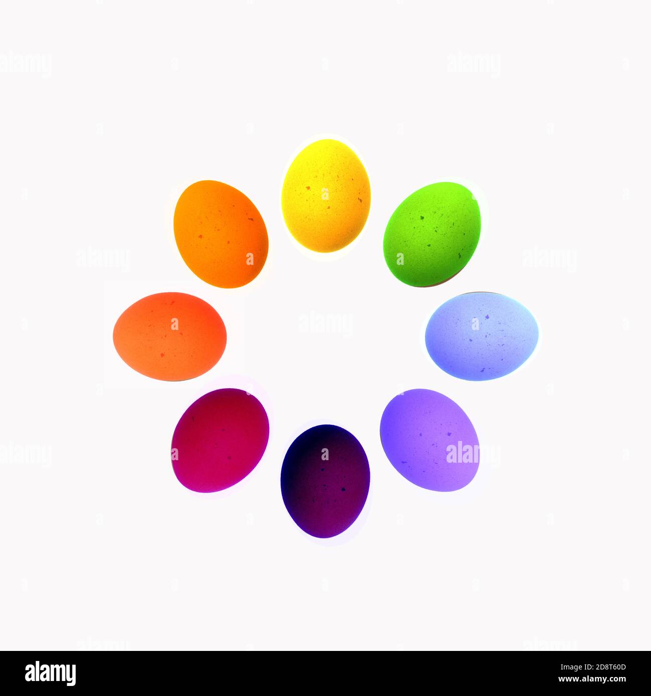 Otto uova disposte a cerchio in colori luminosi Foto Stock