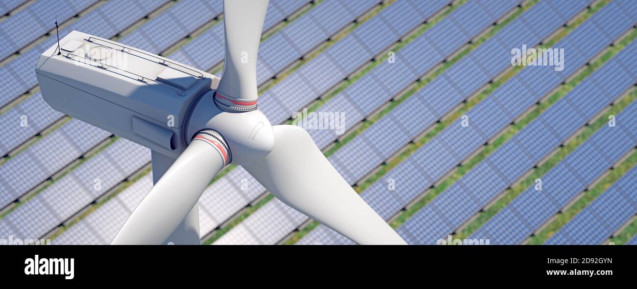 Spettacolare scatto aereo di un mulino a vento con un parco solare sullo sfondo. (2) Foto Stock