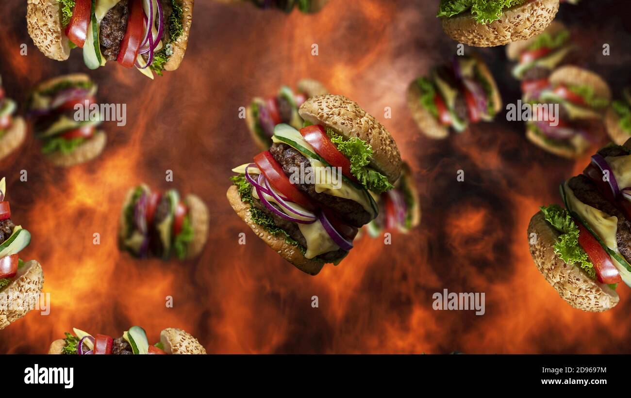 Hamburger che cadono con fumo e fuoco in background. Promo menu fast food. Foto Stock