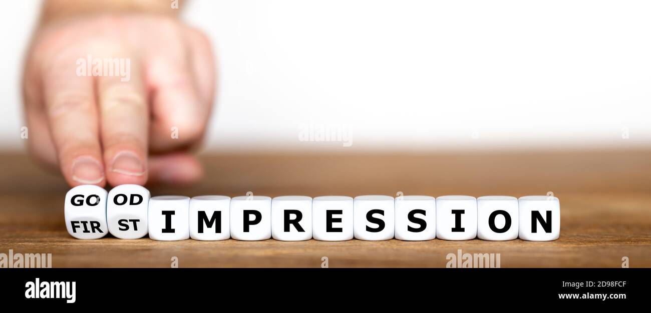 I dadi formano l'espressione "buona prima impressione". Foto Stock