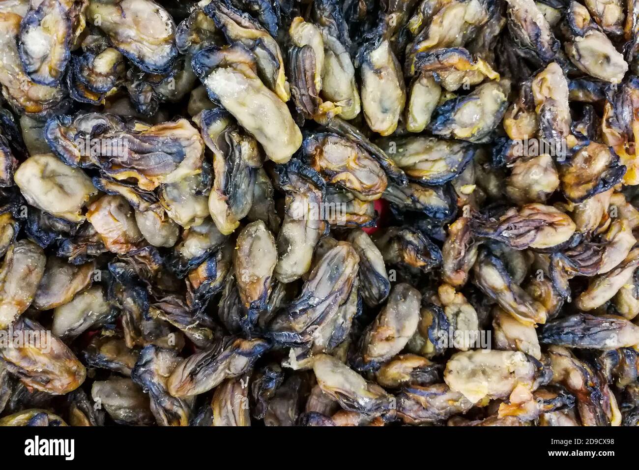 Un mucchio di ostriche secche conservate, ingrediente alimentare popolare cinese Foto Stock