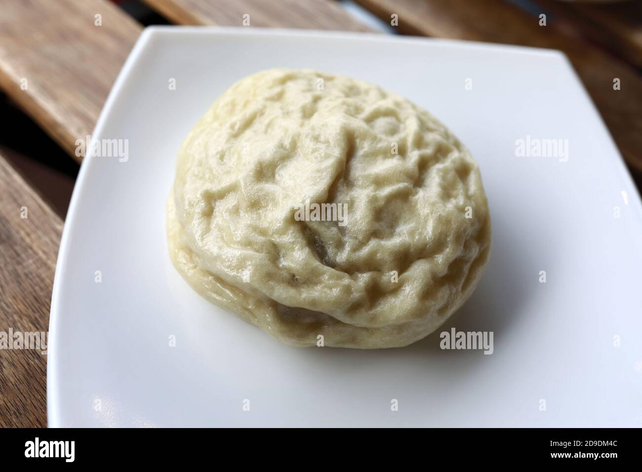 Banh bao sul piatto in ristorante vietnamita Foto Stock