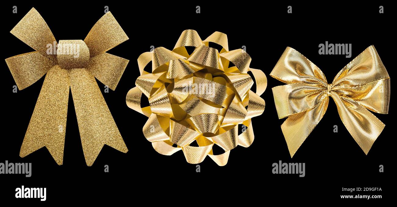 Arco isolato su sfondo nero. Decorazione regalo d'oro Foto Stock