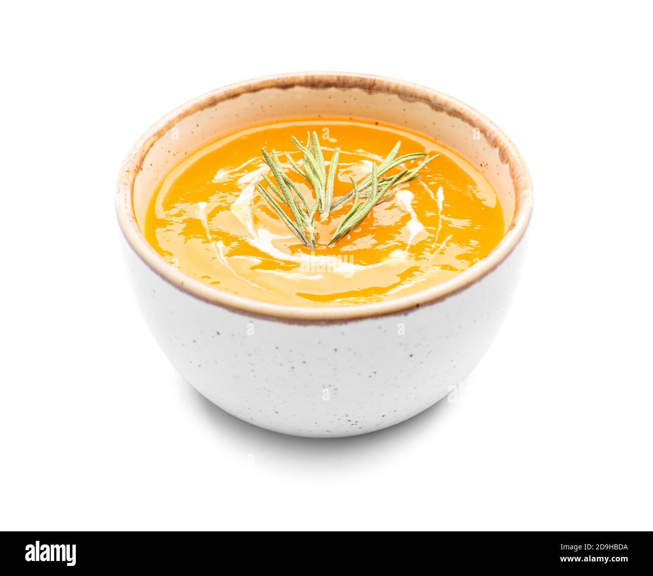 Gustosa zuppa di crema di zucca in ciotola su sfondo bianco Foto Stock