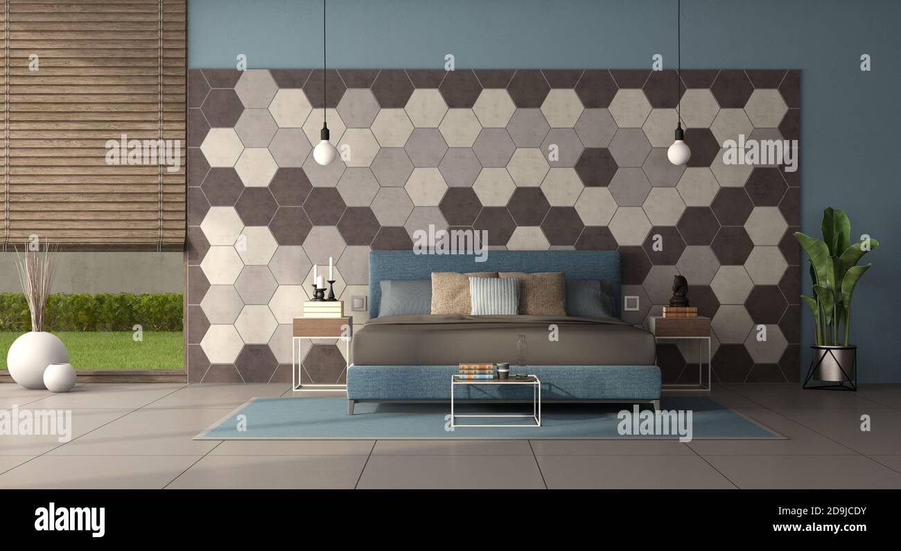 Camera da letto moderna con letto matrimoniale davanti a una parete con piastrelle esagonali - rendering 3d Foto Stock