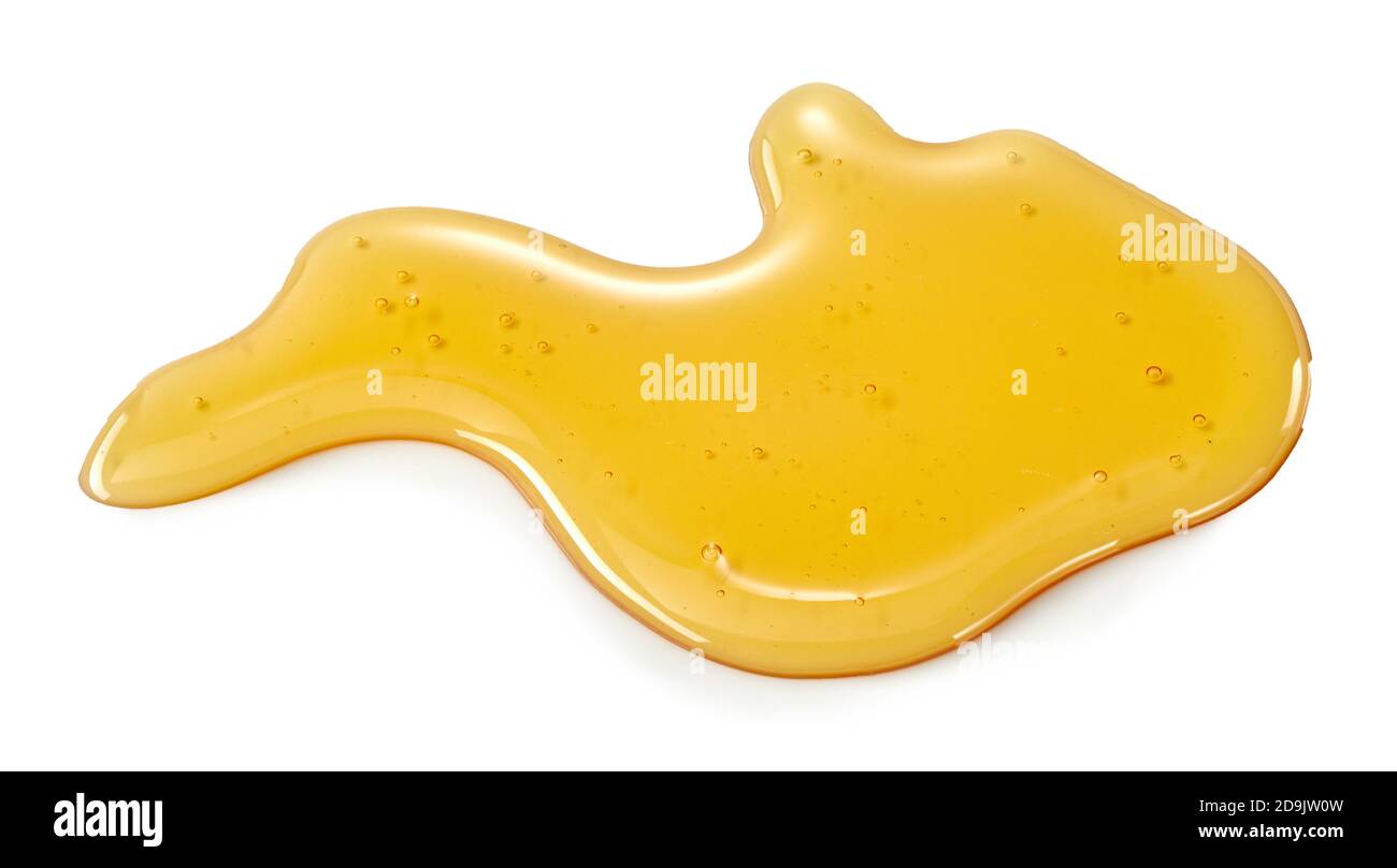 Grande blob di miele dorato organico sano su bianco ricco in antiossidanti e zucchero Foto Stock