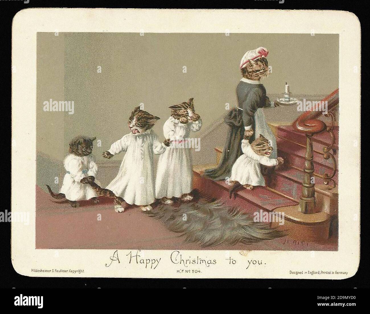 Gatti che desiderano un Buon Natale. Vecchia illustrazione della scheda chrismas in uno stile vintage. Foto Stock