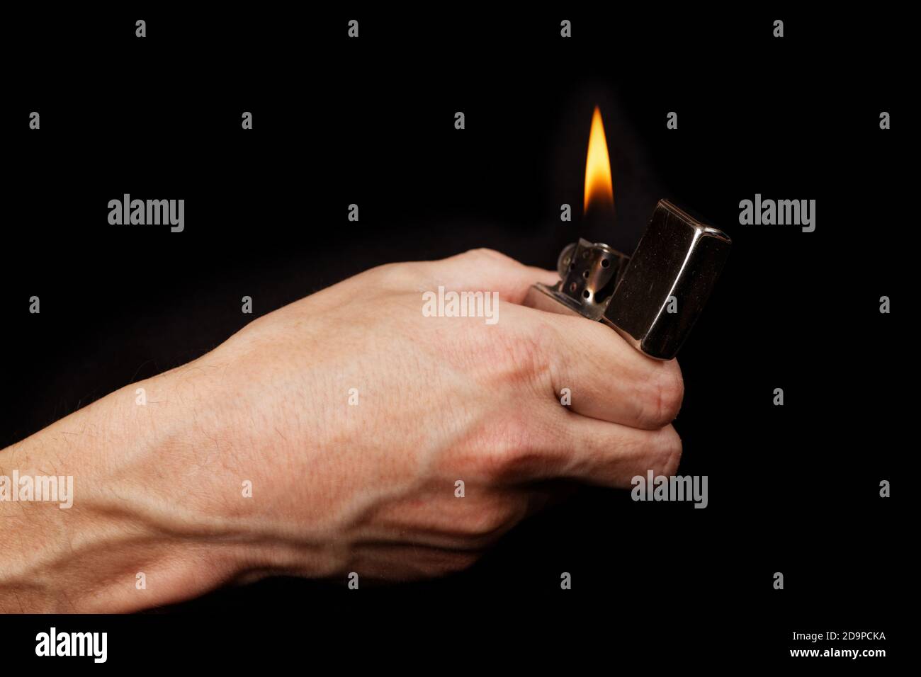 Hand with a lighter immagini e fotografie stock ad alta risoluzione - Alamy