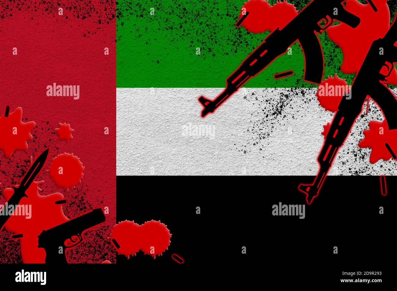 Bandiera degli Emirati Arabi Uniti e cannoni a sangue rosso. Concetto di attacco terroristico e operazioni militari. Traffico di armi Foto Stock
