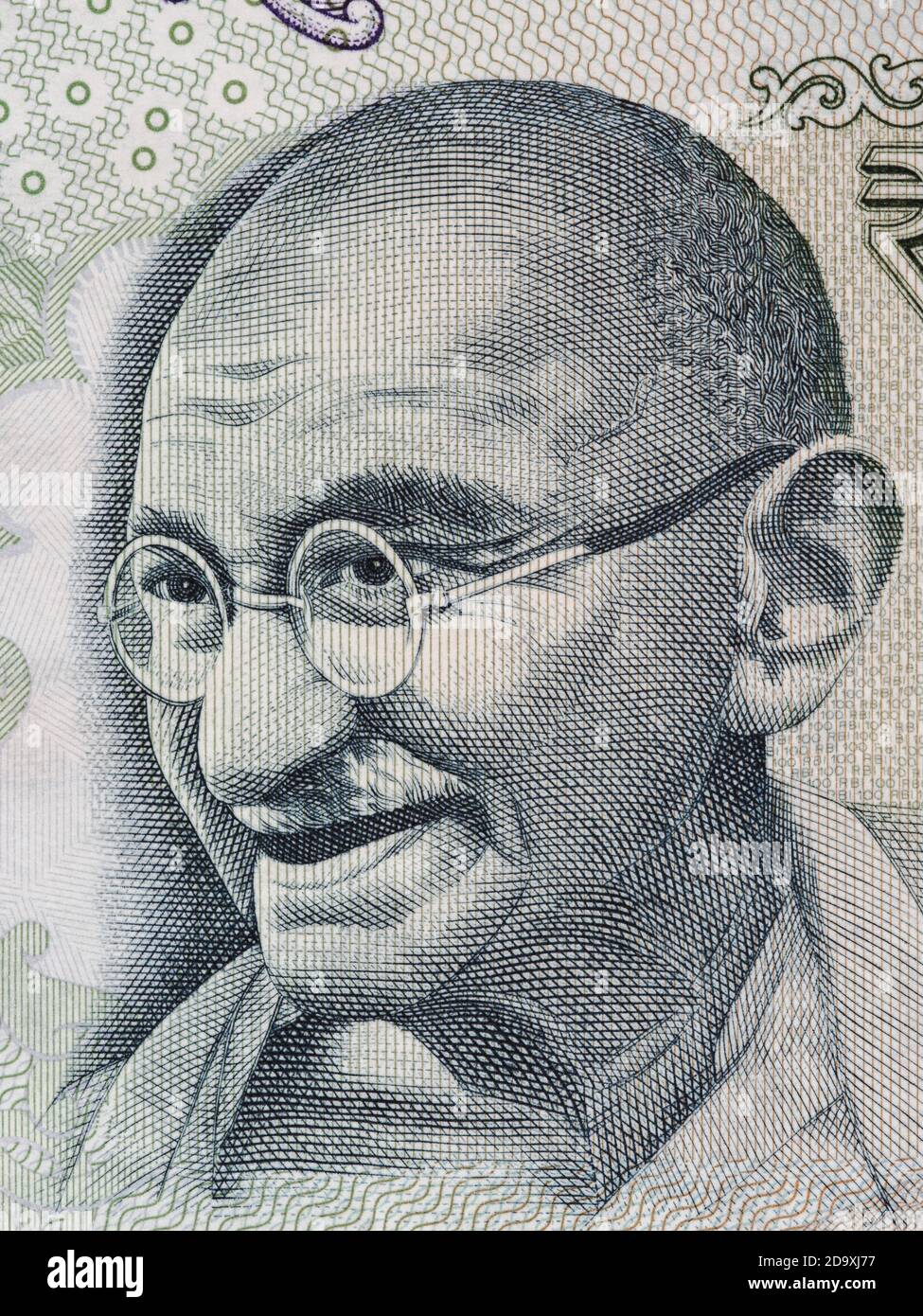 Ritratto di Mahatma Gandhi su macro di banconote da rupie indiane 100, primo piano di denaro dell'India Foto Stock