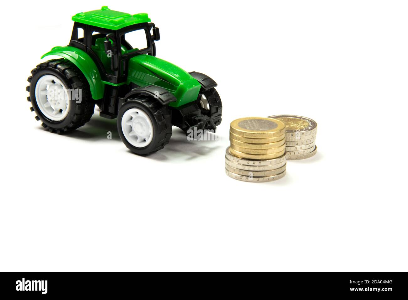 Un trattore e denaro in euro Foto Stock