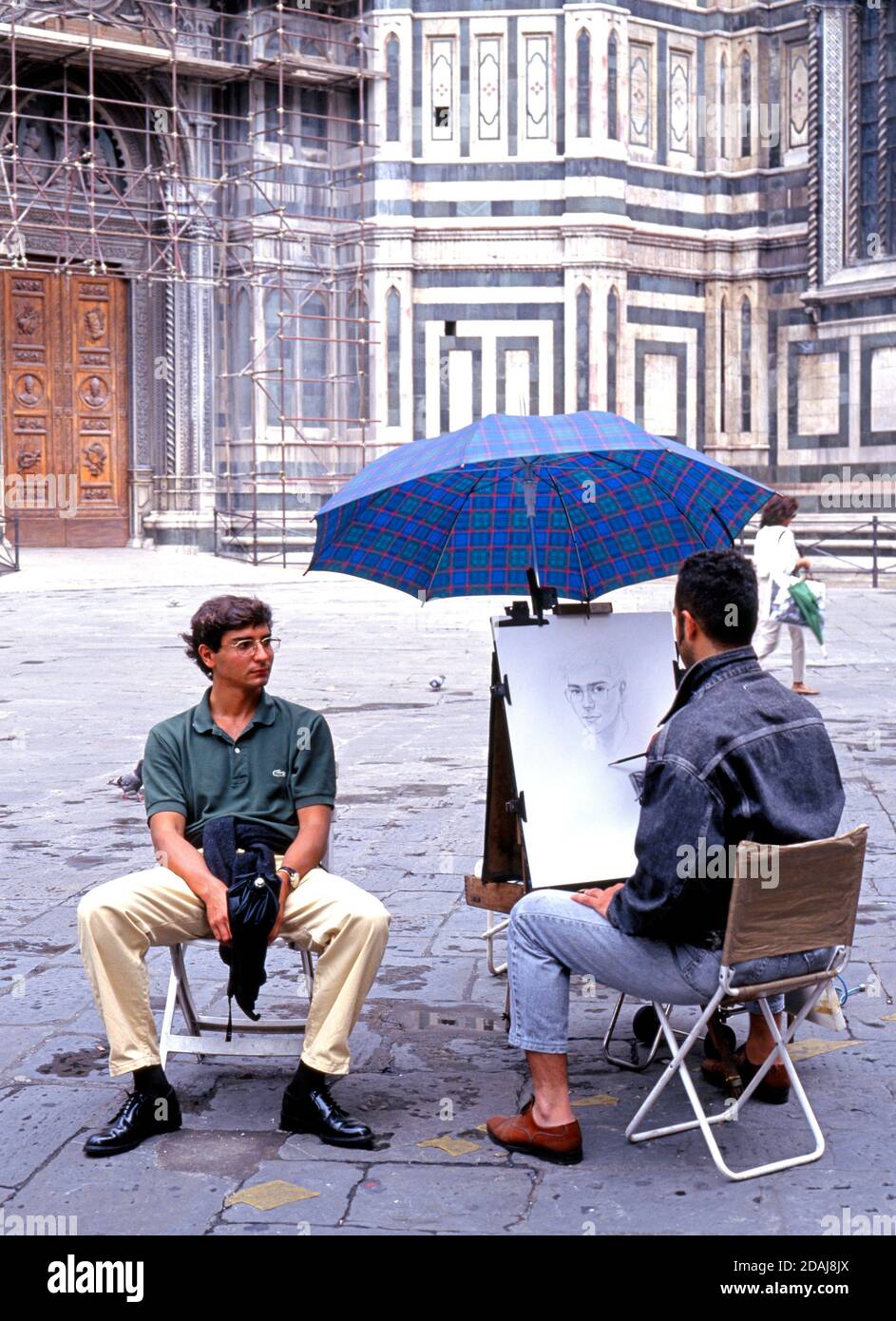 Artista di strada fuori dal Duomo, Firenze, Toscana, Italia, Europa. Foto Stock