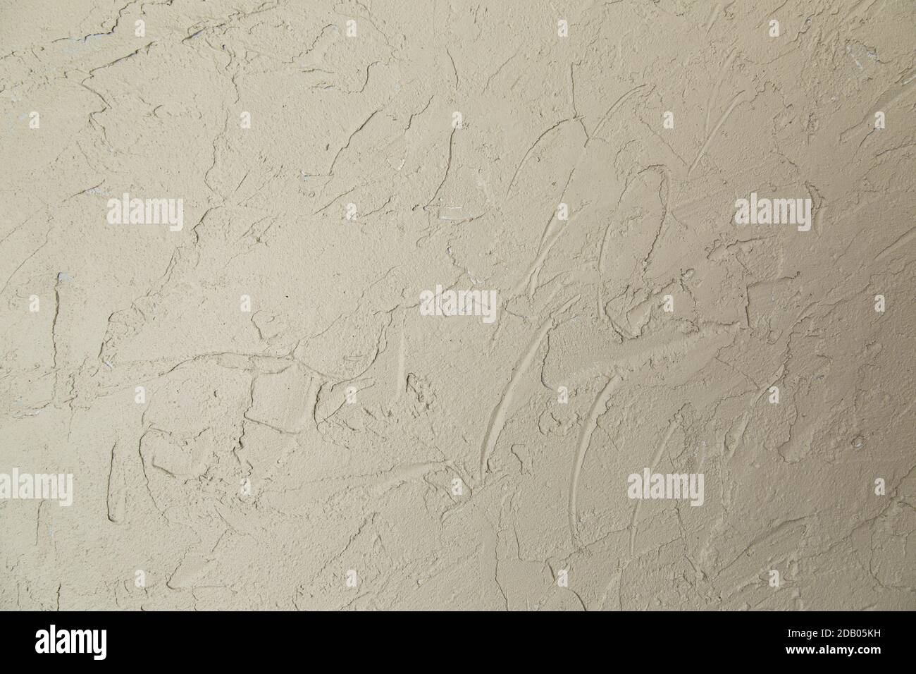 La parete è decorata con intonaco decorativo per calcestruzzo, intonaco. Colore chiaro. Foto Stock