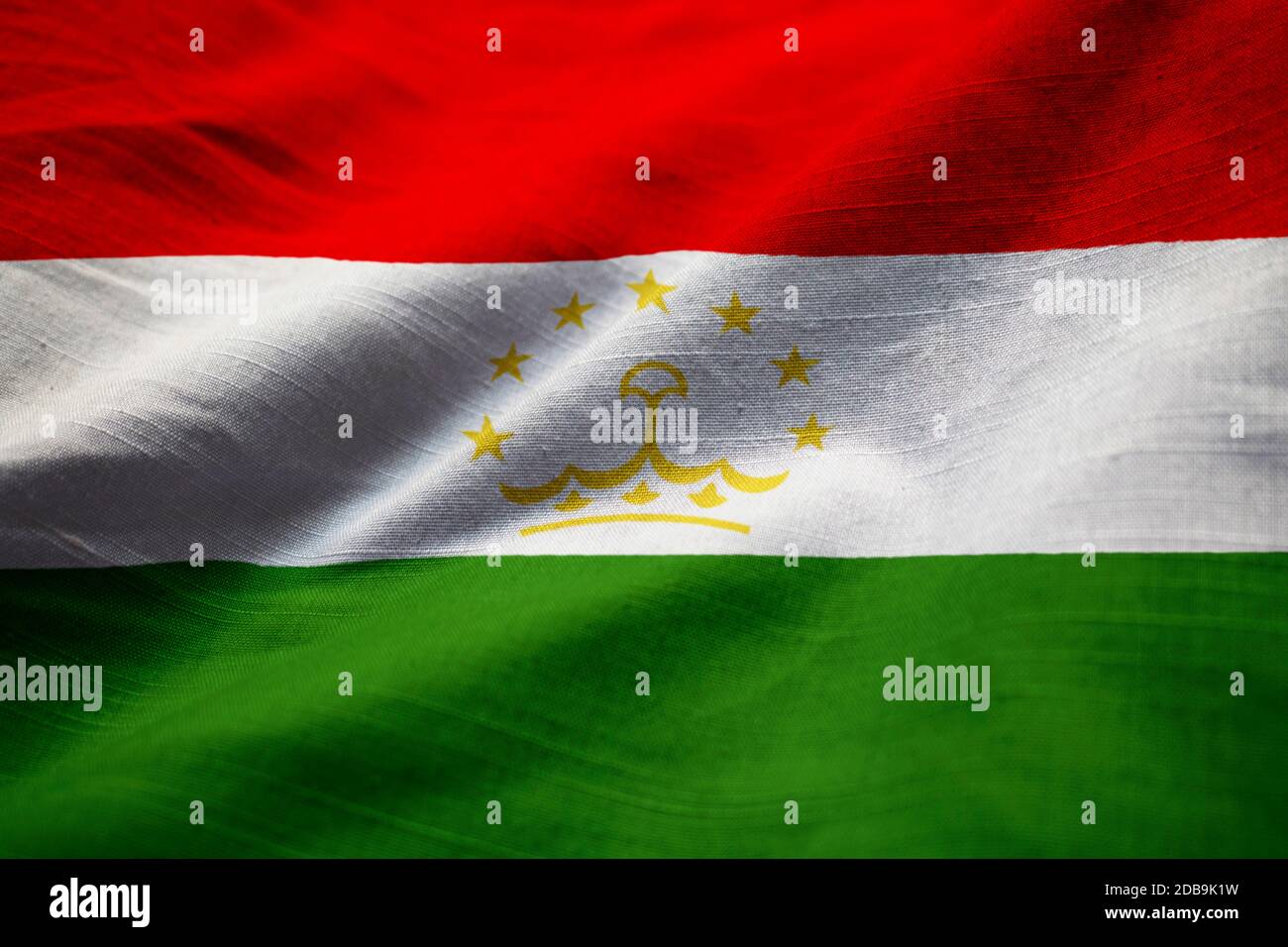 Closeup di bandiera di Tagikistan ruffled, bandiera di Tagikistan che soffia nel vento Foto Stock