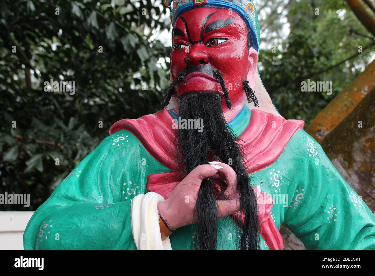 statua di un diavolo (?) a haw par villa a singapore Foto Stock