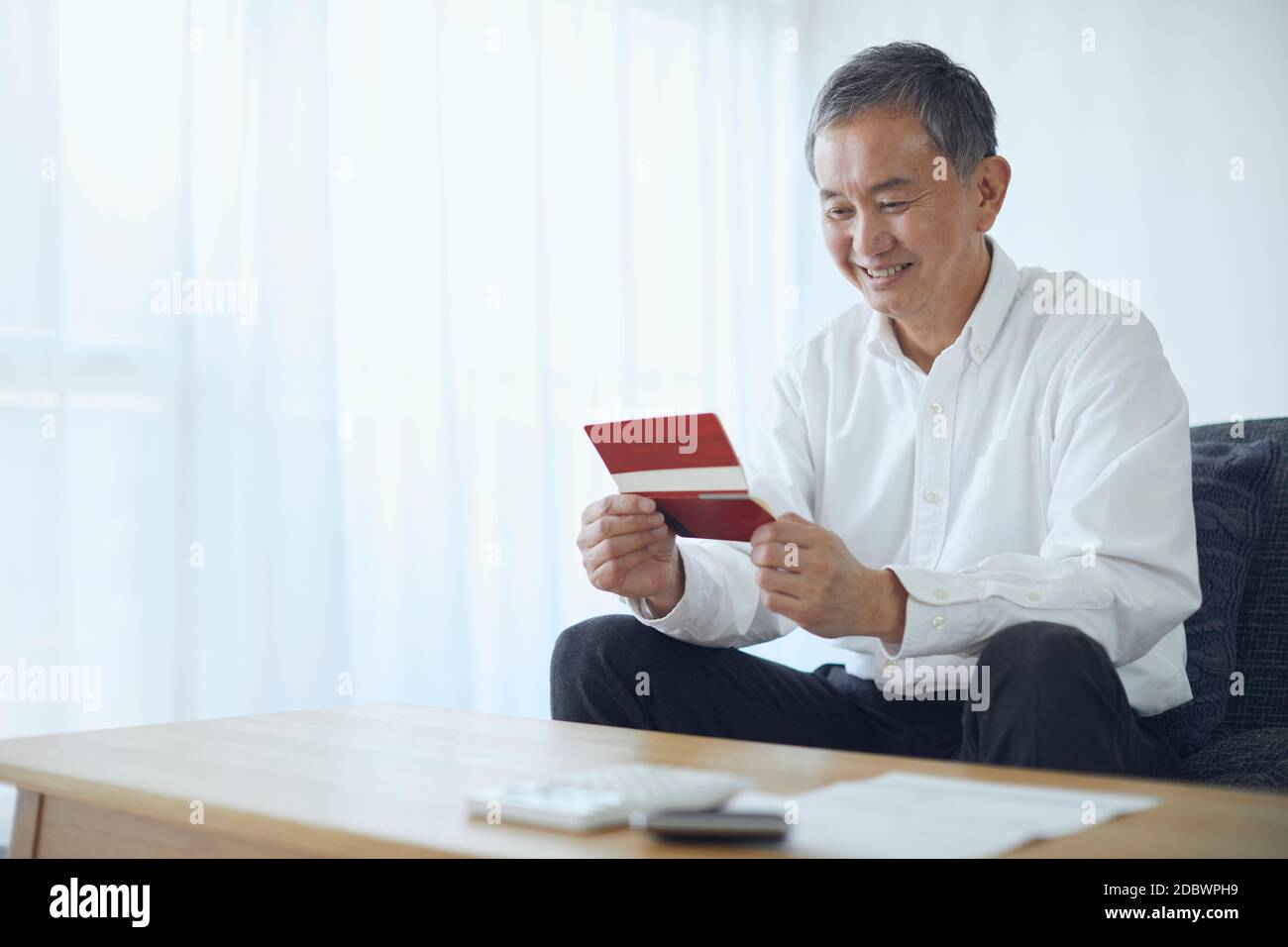Giapponese Senior a casa Foto Stock