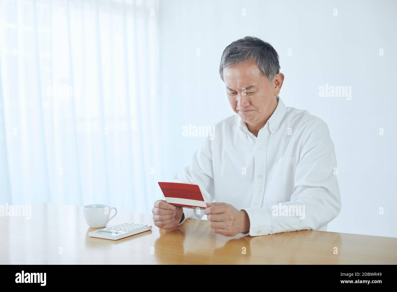 Giapponese Senior a casa Foto Stock