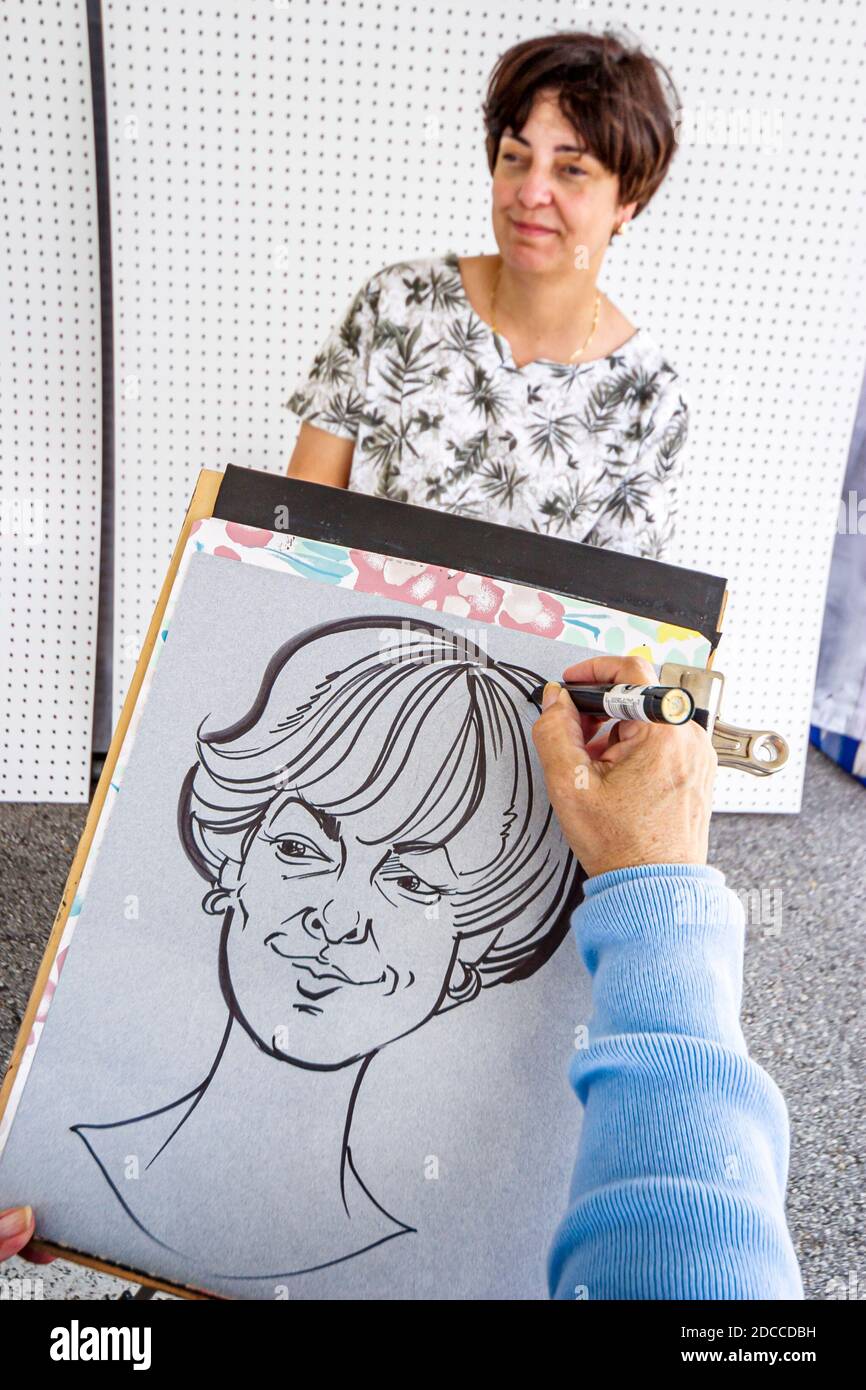 Miami Florida,Dadeland Mall ArtVentures ART festival fair,ritratto artista disegno caricatura donna, Foto Stock