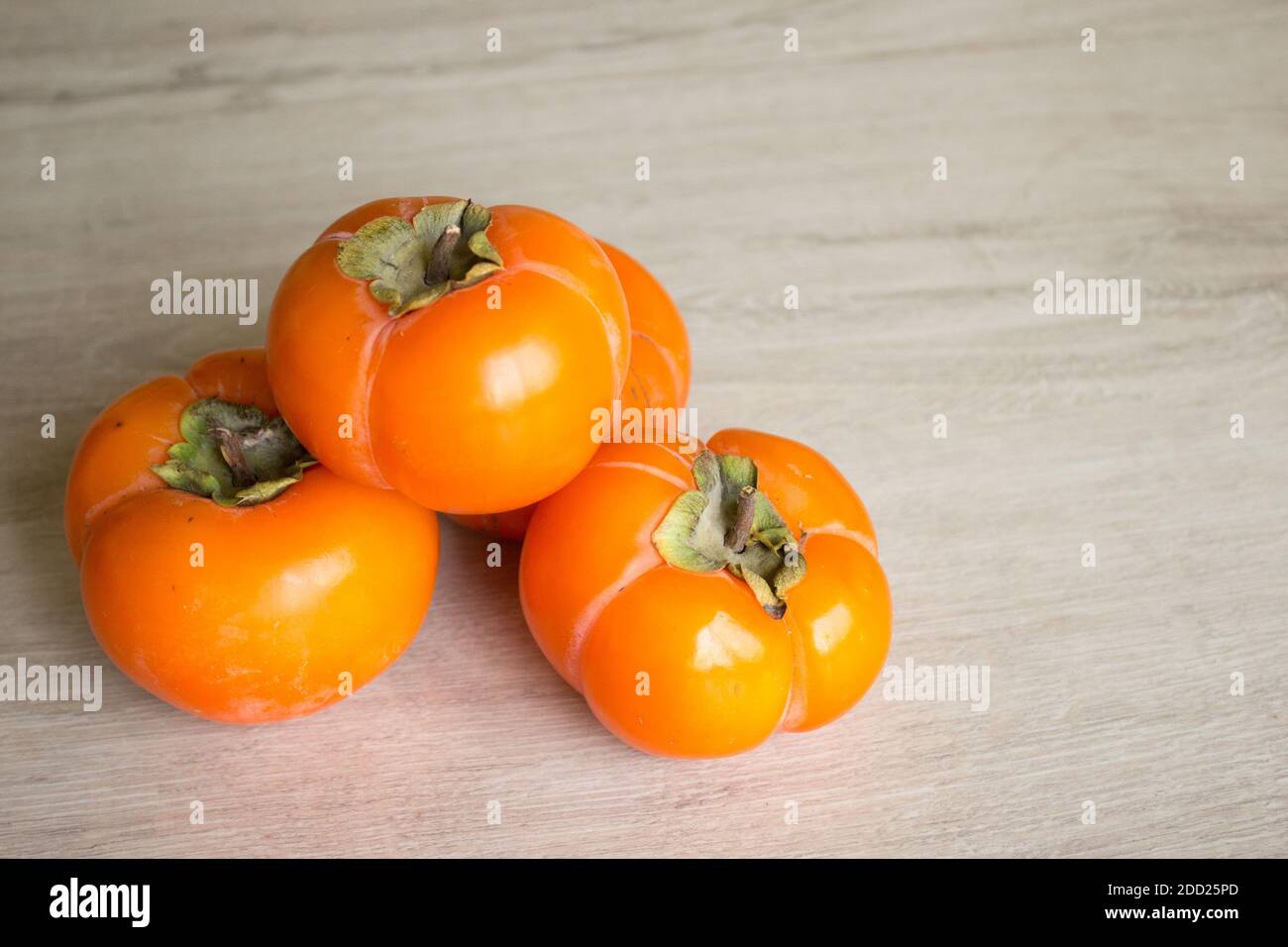Fresco persimmon maturo, persimmon. Vitamine in inverno Foto Stock
