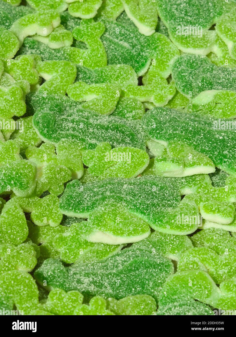Un mazzo di dolci verdi come sfondo. Primo piano caramelle. Foto Stock