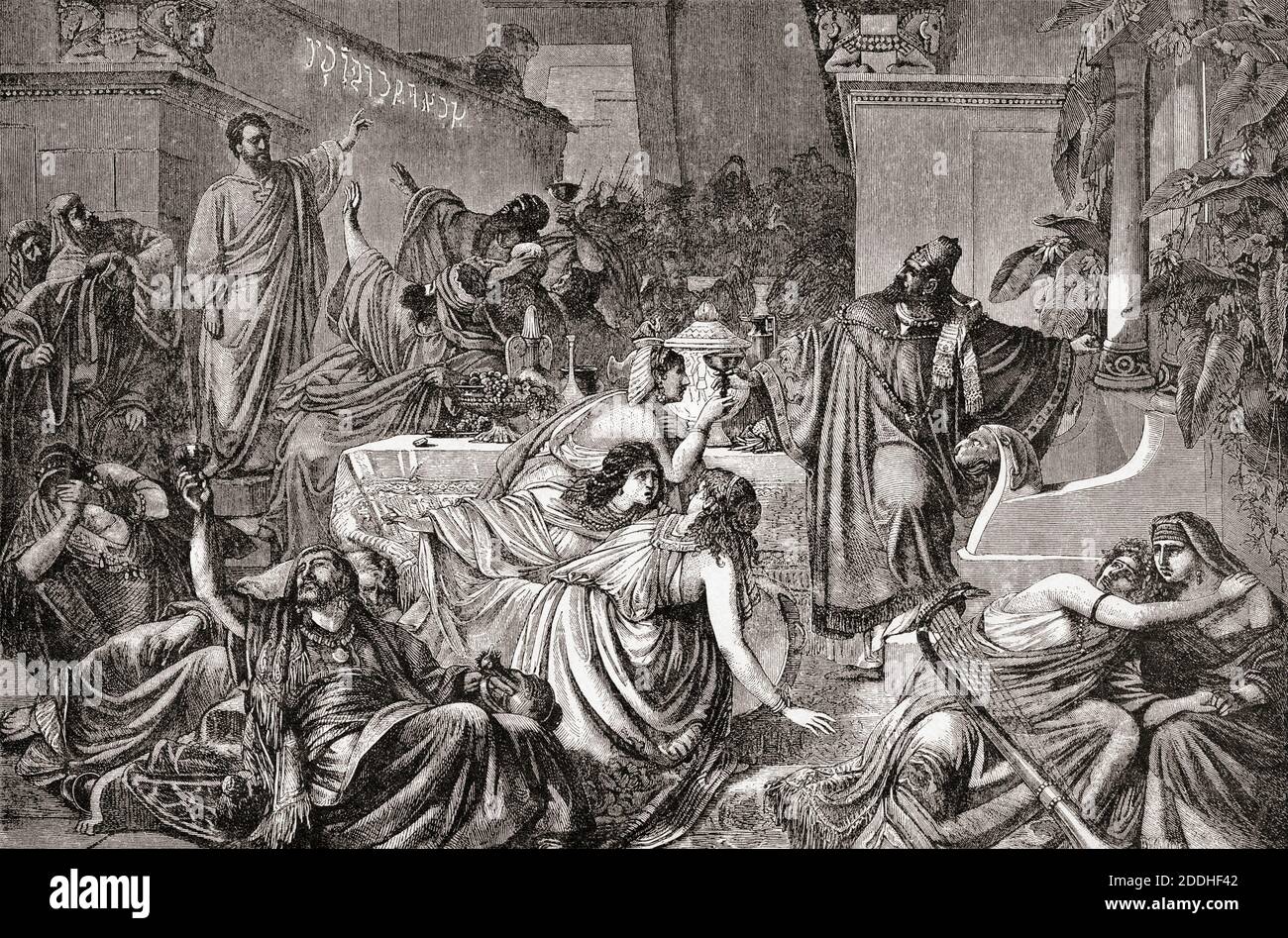 Daniele interpreta la scrittura sul muro a Babilonia alla festa di Belshazzar. La scrittura preconse la caduta di Babilonia. Dopo un lavoro di Paul Marc Joseph Chenavard. Foto Stock