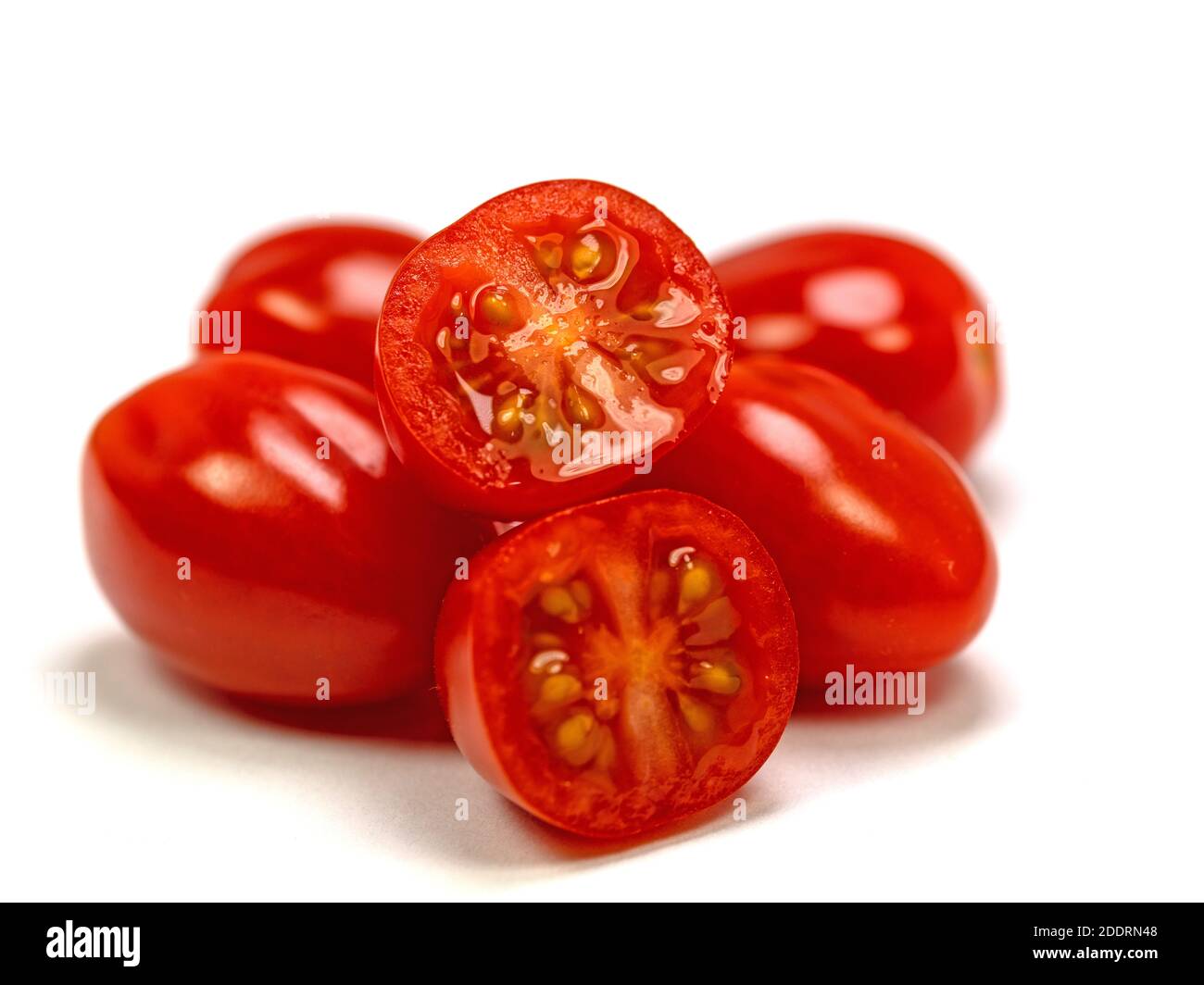 Mini pomodori roma su sfondo bianco Foto Stock
