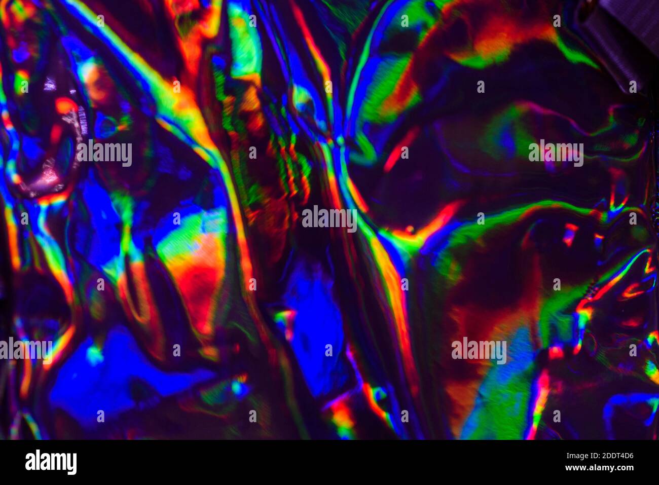 Vibrante e alla moda. Olografica sfondo colorato astratto iridescente offuscato. Foto Stock