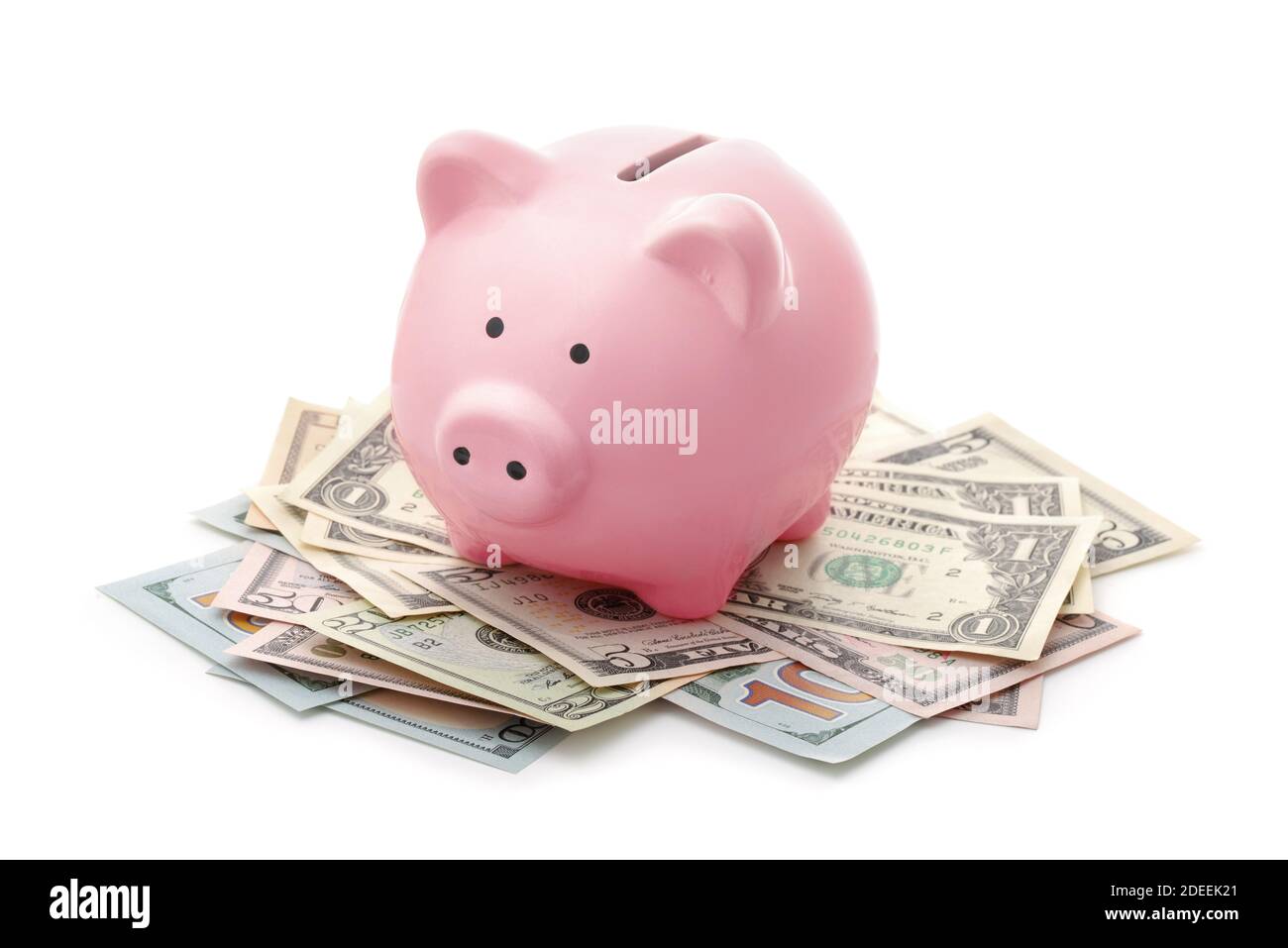 Pink piggy bank e US dollari banconote isolato su bianco Foto Stock