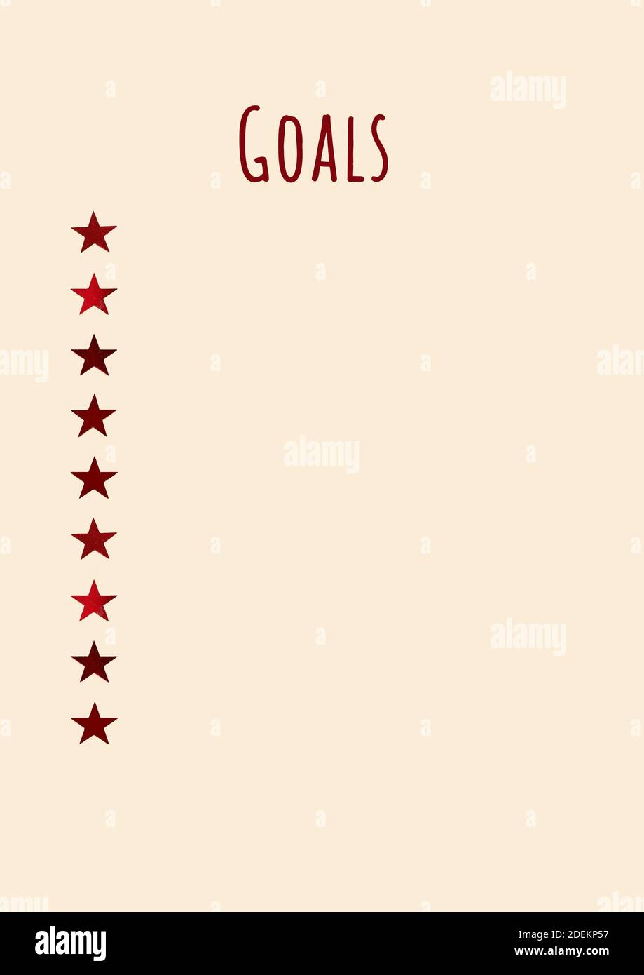 Obiettivi. Scintilla sotto forma di stelle, un foglio di blocco note beige, vista dall'alto Foto Stock